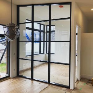 Interior storefront used as a room divider - Valley West Glass